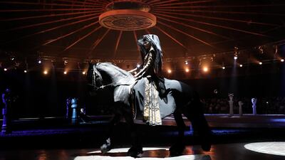 A model on horseback during the Heaven Gaia show by Chinese designer Xiong Ying. Getty Images
