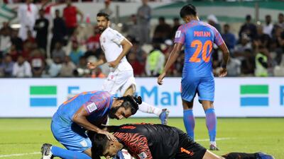 Jhingan protects goalkeeper Gurpreet Singh Sandhu. AFP