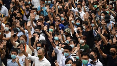 Pro-democracy demonstrators hold up their hands to symbolise their five demands during a protest against an expected government ban on protesters wearing face masks at Chater Garden in Hong Kong. Hong Kong's government was expected to meet October 4 to discuss using a colonial-era emergency law to ban pro-democracy protesters from wearing face masks, in a move opponents said would be a turning point that tips the financial hub into authoritarianism. AFP