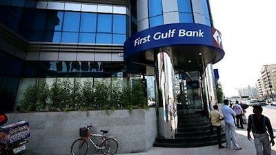 First Gulf Bank's shares total will double after the dividend is approved at the company's annual meeting, after which the stock's price will be adjusted to reflect the larger number of shares. Paulo Vecina / The National