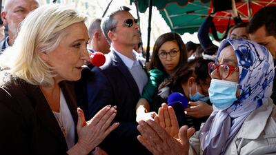 Marine Le Pen, the far-right candidate in the French presidential election, meets voters in the southern commune of Pertuis, near Marseille, on Friday. Reuters