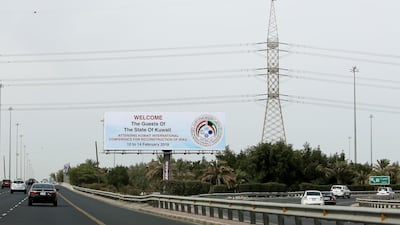 A billboard in Kuwait City welcomes participants to the Kuwait International Conference for Reconstruction of Iraq. Yasser Al Zayyat / AFP
