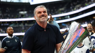 Ange Postecoglou with the Europa League trophy after Tottenham Hotspur's victory over Manchester United in the final. Reuters