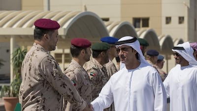 Sheikh Hazza greets military officers at the Seih Hafair Camp. With him is Sheikh Nahyan bin Zayed, Chairman of the Board of Trustees of the Zayed bin Sultan Al Nahyan Charitable and Humanitarian Foundation. Ryan Carter / Crown Prince Court - Abu Dhabi