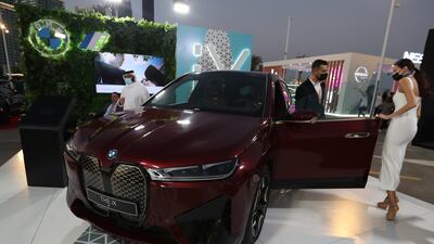 Visitors inspect the new BMW iX. EPA