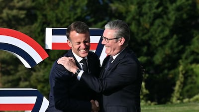 Mr Macron greets Mr Starmer in the French Alps. AFP