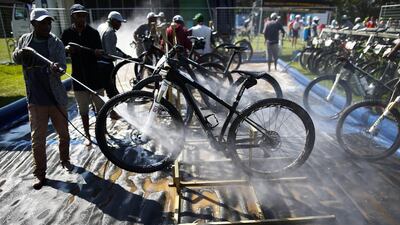 Bicycles get power washed at the finish of the prologue of the Absa Cape Epic mountain bike race in Cape Town on Sunday. Nic Bothma / EPA