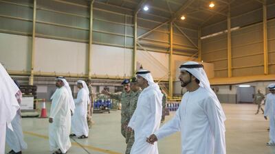 Sheikh Hamdan bin Mohammed, right, and Sheikh Hazza bin Zayed, National Security Advisor and Vice Chairman of the Abu Dhabi Executive Council, centre, visit King Fahd Air Base. Mohammed Al Hammadi / Crown Prince Court - Abu Dhabi