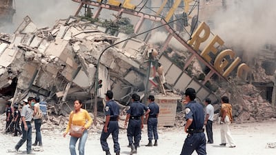 A photo taken on 21 September 1985 shows the ruins of Hotel Regis, flattened in the 19 September earthquake, that struck Mexico City, killing up to 10,000 people. Derrick Ceyrac / AFP