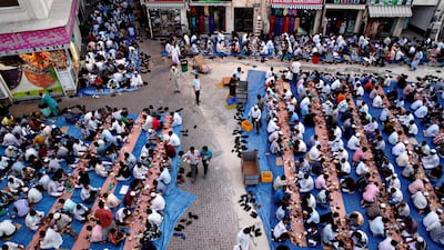Thousands of men break fast together outside Masjid Kuwait Lootah Mosque in Deira, Dubai, July 31, 2013. Sarah Dea / The National