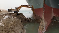 'Ever Given' settled diagonally across the Suez Canal in March 2021, wedging itself against one side and blocking the other. AFP