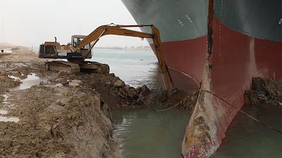 'Ever Given' settled diagonally across the Suez Canal in March 2021, wedging itself against one side and blocking the other. AFP