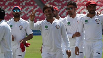 Asghar Afghan, centre, scored 50 from 122 balls for Afghanistan in their one-off test against Bangladesh on Saturday. AFP