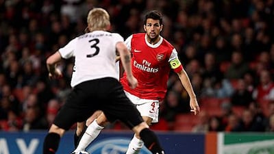 Cesc Fabregas, who is playing further forward this season, takes on a Shakhtar Donetsk defender in midweek Champions League action.