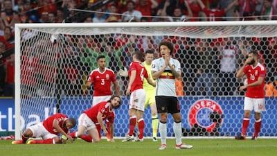 Belgium midfielder Axel Witsel reacts after Wales block a succession of shots. John Sibley / Reuters