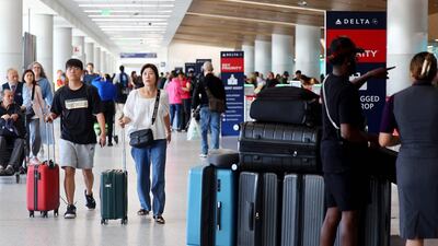 Travellers pass through the Delta terminal at Los Angeles International Airport. The International Air Transport Association said the post-Covid recovery momentum continued in July amid higher passenger traffic. AFP