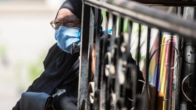 An elderly woman waits to vote. EPA