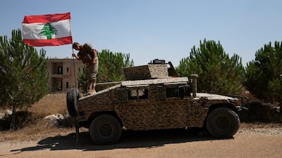 A soldier on an armoured vehicle in Zawtar Al Gharbiyeh. Reuters