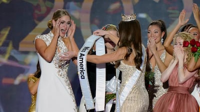 Stanke is presented with the Miss America 2023 sash by Broyles