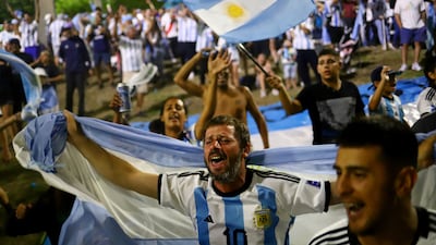 Fans gather outside of the Association of Argentinian Football Headquarters ahead of the team arrival. Reuters