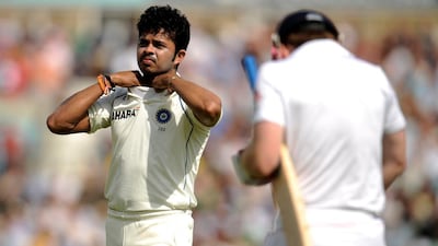 India's Sreesanth waits for the arrival of England's Eoin Morgan (R) after the dismissal of James Anderson during the fourth cricket test match at the Oval cricket ground in London August 20, 2011. REUTERS/Philip Brown