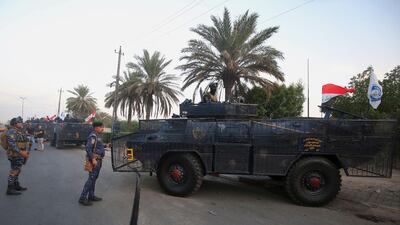 Iraqi police are seen deployed in Baghdad's predominantly Shiite Sadr City. Demonstrations across Baghdad and the south have spiralled into violence over the last week, with witnesses reporting security forces using water cannons, tear gas and live rounds and authorities saying "unidentified snipers" have shot at protesters and police. On Sunday evening a mass protest in Sadr City in east Baghdad led to clashes that medics and security forces said left 13 people dead. AFP