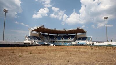 In this August 2, 2012 file photo, weeds sprout in the remains of what was once the playing field at the abandoned Olympic softball venue in southern Athens. The legacy of Athens’ Olympics has stirred vigorous debate, and Greek authorities have been widely criticized for not having a post-Games plan for the infrastructure. While some of the venues built specifically for the games have been converted for other uses, many are underused or abandoned, and very few provide the state with any revenue. Some critics even say that the multibillion dollar cost of the games played a modest role in the nation’s 2008 economic meltdown. Thanassis Stavrakis / AP Photo