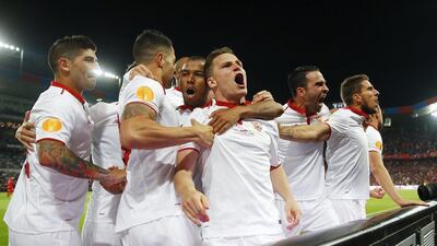 Sevilla players celebrate. Michael Dalder / Reuters