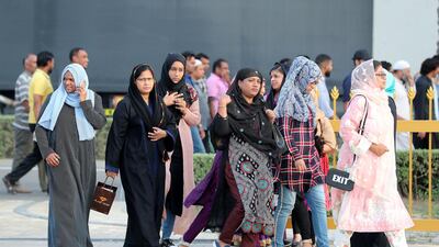 People prepare to break their fast on the first day of Ramadan at the Sheikh Zayed Grand Mosque in Abu Dhabi. Pawan Singh / The National