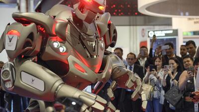 Titan, a robot that speaks English and Arabic, makes a quick appearance during the International Exhibition for National Security and Resilience in Abu Dhabi on Wednesday. Khushnum Bhandari / The National