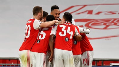 Aubameyang and teammates celebrate the second. AP