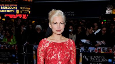 In a red lace midi dress for the "Blue Valentine" premiere during the 54th BFI London Film Festival on October 15, 2010. Getty Images