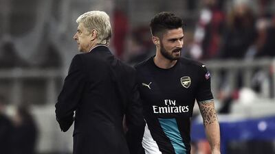 Olivier Giroud, right, is hoping to win the confidence of his manager Arsene Wenger. Angelos Tzortzinis / AFP