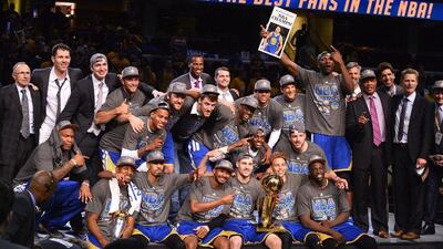 Golden State Warrios celebrate with the NBA Finals trophy after winning game 6 to clinch the series. Larry W Smith Corbis / EPA