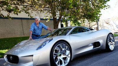 Leno with the Jaguar C-X75 outside his garage in Burbank, California. Photo: Sandy Huffaker / IncWorld