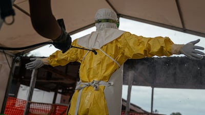 A medic working for Doctors Without Borders takes off their protective equipment at an Ebola treatment centre in the Democratic Republic of Congo. AFP