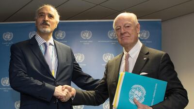 UN envoy Staffan de Mistura (R) and Syrian chief negotiator Bashar Al Jaafari shake hands before the start of peace talks in Vienna on January 25, 2018. Alex Halada/AFP