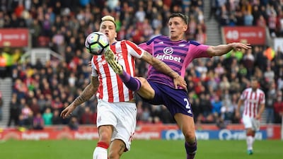 Marko Arnautovic of Stoke City, left, and Billy Jones of Sunderland battle during the match between Stoke City and Sunderland at Bet365 Stadium on October 15, 2016 in Stoke on Trent, England. Stu Forster / Getty Images