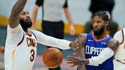 Paul George, right, took charge for the Los Angeles Clippers in the win over the Cleveland Cavaliers. AP Photo