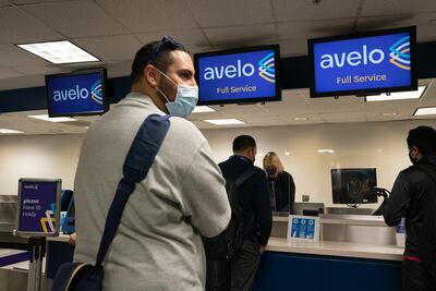 Passenger wearing protective masks check-in at Hollywood Burbank Airport in Burbank, California. Bloomberg