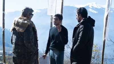 Mukerji, centre, on set with Amitabh Bachchan, left, and Kapoor.