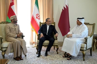 Iranian Foreign Minister Abbas Araghchi, centre, holds talks with Qatari Prime Minister and Foreign Minister Sheikh Mohammed bin Abdulrahman, right, and Oman's Foreign Minister Badr Al Busaidi, in Tehran on May 18. Iranian Foreign Ministry / EPA