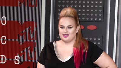 Rebel Wilson, wearing a black and pink peplum dress, attends the 32nd MTV Video Music Awards in Los Angeles on August 30, 2015. EPA