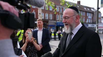 Chief Rabbi Ephraim Mirvis speaks to the media. Getty Images