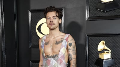 Harry Styles wears a custom diamond-patterned jumpsuit by Egonlab and Swarovski. EPA