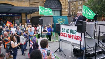 Rail, Maritime, and Transport union general secretary Mick Lynch speaks at a rally outside King's Cross station, in London. PA