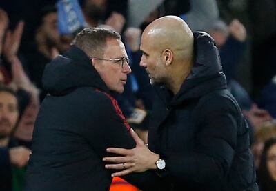 Manchester United interim manager Ralf Rangnick shakes hands with Manchester City manager Pep Guardiola after the match. Reuters