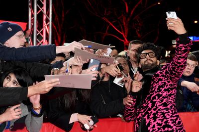 Ranveer Singh poses for a selfie with a fan while attending the 'Gully Boy' premiere during the 69th Berlinale International Film Festival Berlin. Getty Images