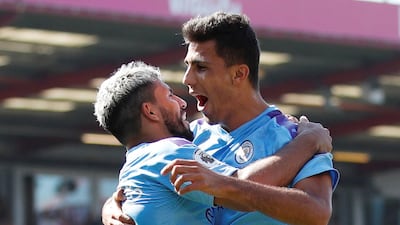 Manchester City's Sergio Aguero celebrates with Rodri. Reuters