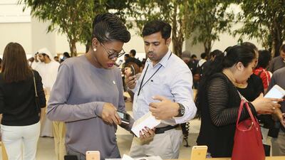 The first customers take a look at the products. Sarah Dea / The National